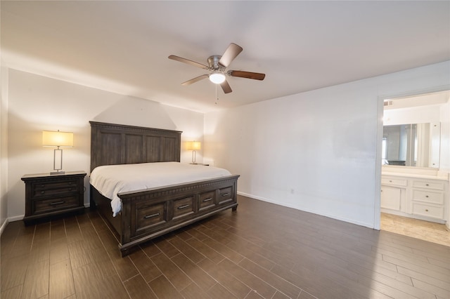 7838 Vickijohn Dr, Houston, TX 77071 - bedroom featuring dark wood finished floors, baseboards, ensuite bath, and a ceiling fan