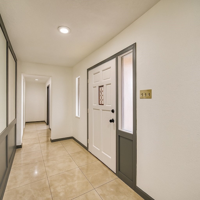 7838 Vickijohn Dr, Houston, TX 77071 - foyer entrance with light tile patterned floors, baseboards, and recessed lighting