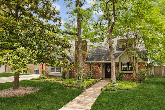 233 Magnolia Way, Huntsville, TX 77320 - view of front of home with brick siding, roof with shingles, and concrete driveway