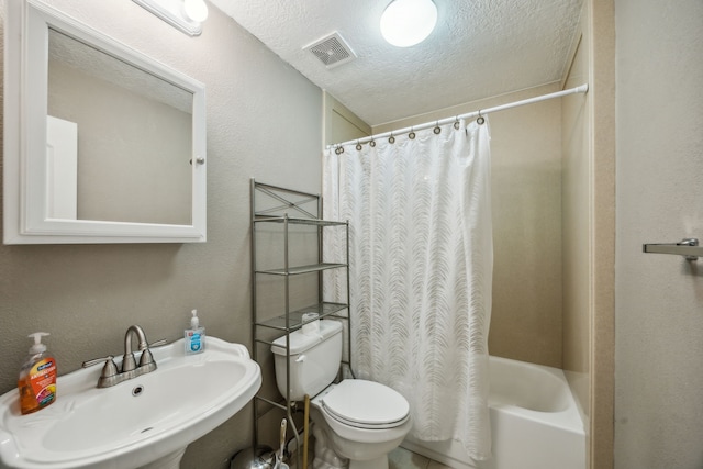 233 Magnolia Way, Huntsville, TX 77320 - bathroom featuring a sink, toilet, a textured ceiling, shower / bath combo, and a textured wall