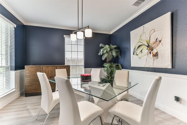 1753 Cranston Grove Dr, Dickinson, TX 77539 - dining area featuring wood finished floors, crown molding, and baseboards