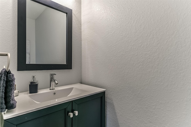 1753 Cranston Grove Dr, Dickinson, TX 77539 - bathroom featuring a textured wall and vanity
