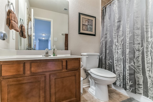 1753 Cranston Grove Dr, Dickinson, TX 77539 - bathroom featuring toilet, a textured wall, vanity, a shower with curtain, and tile patterned flooring