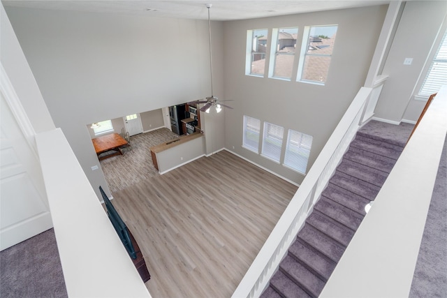 213 Splintered Arrow Dr, La Marque, TX 77568 - interior space with ceiling fan, stairs, healthy amount of natural light, and wood finished floors