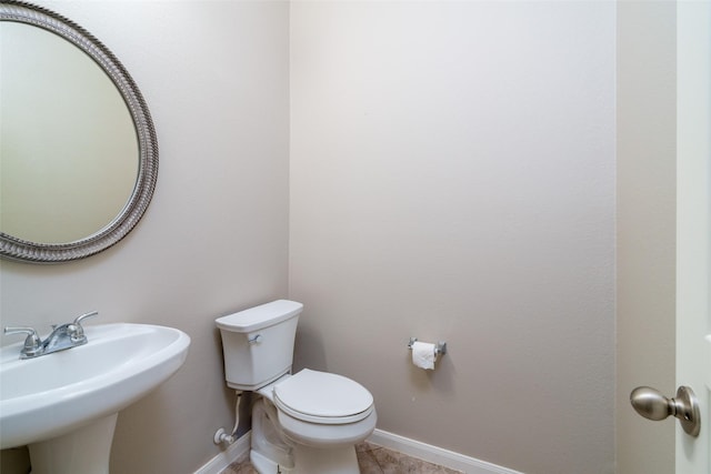 213 Splintered Arrow Dr, La Marque, TX 77568 - half bath with a sink, baseboards, and toilet