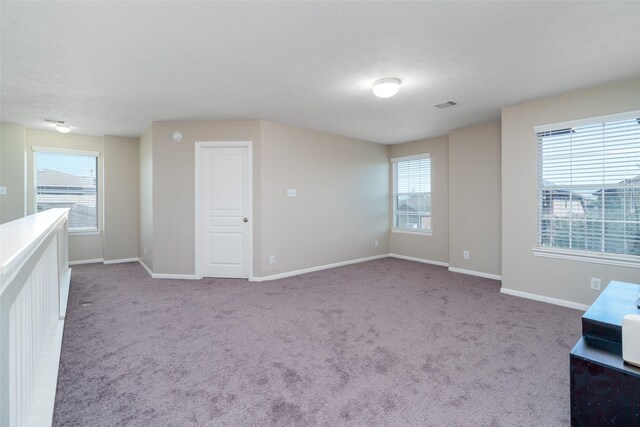 213 Splintered Arrow Dr, La Marque, TX 77568 - carpeted spare room with plenty of natural light and baseboards