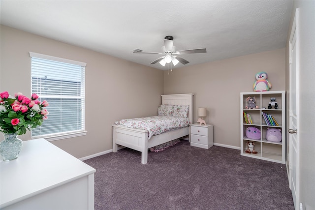 213 Splintered Arrow Dr, La Marque, TX 77568 - bedroom featuring dark carpet, baseboards, and a ceiling fan