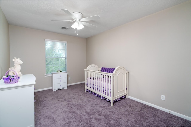 213 Splintered Arrow Dr, La Marque, TX 77568 - carpeted bedroom with baseboards, a nursery area, and a ceiling fan