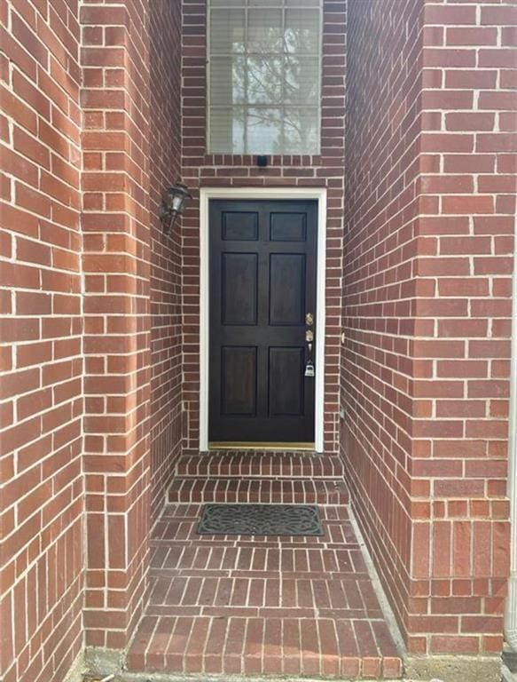 10702 Allens Landing Dr, Houston, TX 77065 - doorway to property featuring brick siding