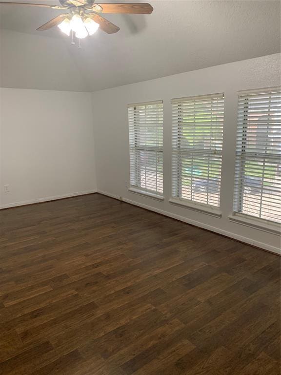 10702 Allens Landing Dr, Houston, TX 77065 - unfurnished room featuring vaulted ceiling, ceiling fan, dark wood-style floors, and baseboards