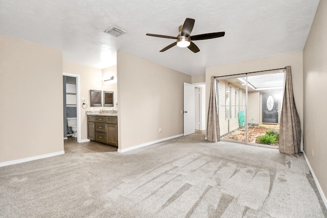 1207 Martingale Ct, Crosby, TX 77532 - unfurnished living room with a ceiling fan, baseboards, and carpet floors