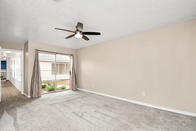 1207 Martingale Ct, Crosby, TX 77532 - empty room with a ceiling fan, carpet, and baseboards