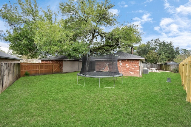 1207 Martingale Ct, Crosby, TX 77532 - view of yard featuring a trampoline and central AC unit