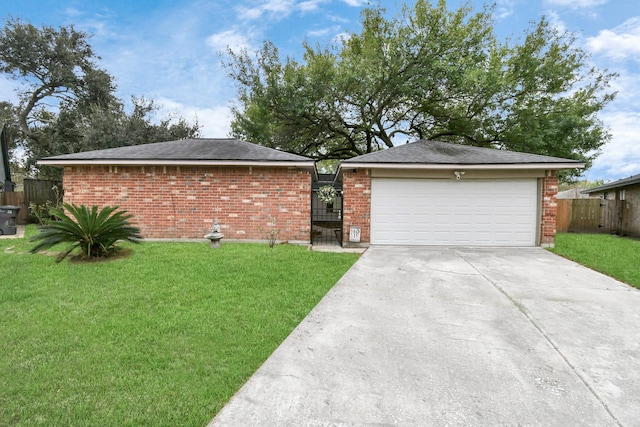 1207 Martingale Ct, Crosby, TX 77532 - view of front of house featuring brick siding, concrete driveway, and a gate
