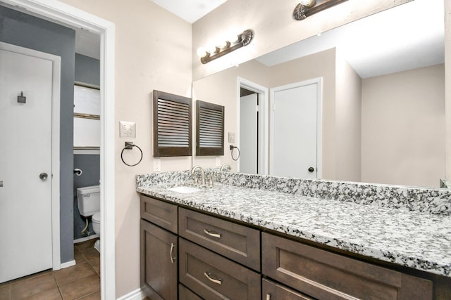 1207 Martingale Ct, Crosby, TX 77532 - bathroom featuring tile patterned floors, toilet, vanity, and baseboards