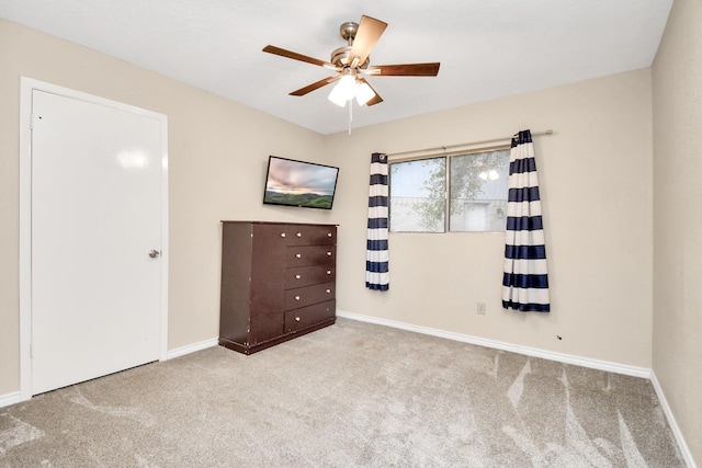 1207 Martingale Ct, Crosby, TX 77532 - unfurnished bedroom with carpet floors, baseboards, and a ceiling fan