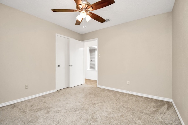 1207 Martingale Ct, Crosby, TX 77532 - unfurnished bedroom with carpet, baseboards, ceiling fan, and a closet