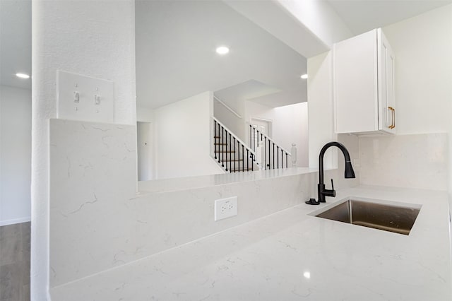 21511 Pepperberry Trl, Spring, TX 77388 - kitchen featuring a sink, white cabinets, decorative backsplash, and recessed lighting