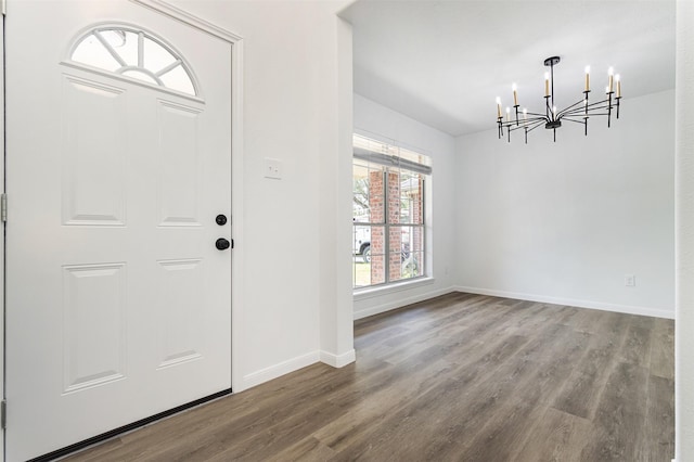 21511 Pepperberry Trl, Spring, TX 77388 - entrance foyer with a chandelier, wood finished floors, and baseboards