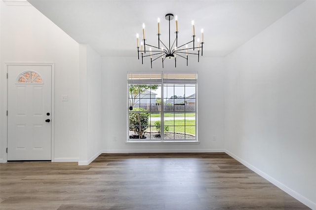 21511 Pepperberry Trl, Spring, TX 77388 - foyer with a chandelier, wood finished floors, and baseboards