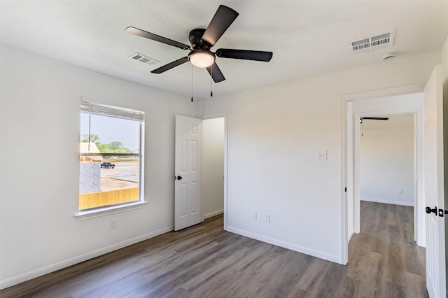 21511 Pepperberry Trl, Spring, TX 77388 - unfurnished bedroom featuring wood finished floors, baseboards, and a ceiling fan