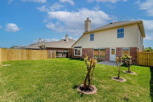 21511 Pepperberry Trl, Spring, TX 77388 - back of property with brick siding and a chimney