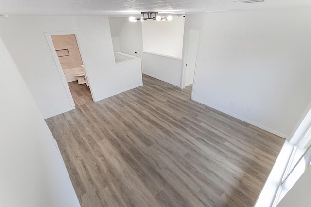 21511 Pepperberry Trl, Spring, TX 77388 - unfurnished room featuring wood finished floors and a chandelier