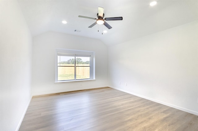 21511 Pepperberry Trl, Spring, TX 77388 - empty room with lofted ceiling, light wood-style floors, ceiling fan, baseboards, and recessed lighting