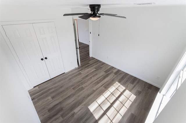 21511 Pepperberry Trl, Spring, TX 77388 - unfurnished bedroom featuring wood finished floors, a closet, baseboards, and ceiling fan