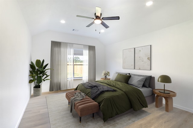 21511 Pepperberry Trl, Spring, TX 77388 - bedroom with vaulted ceiling, baseboards, light wood finished floors, ceiling fan, and recessed lighting