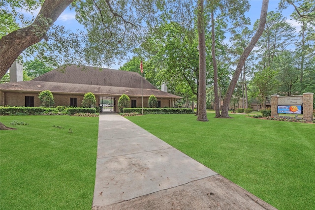 8223 Bairnsdale Ln, Houston, TX 77070 - view of front of property featuring a chimney and a front lawn