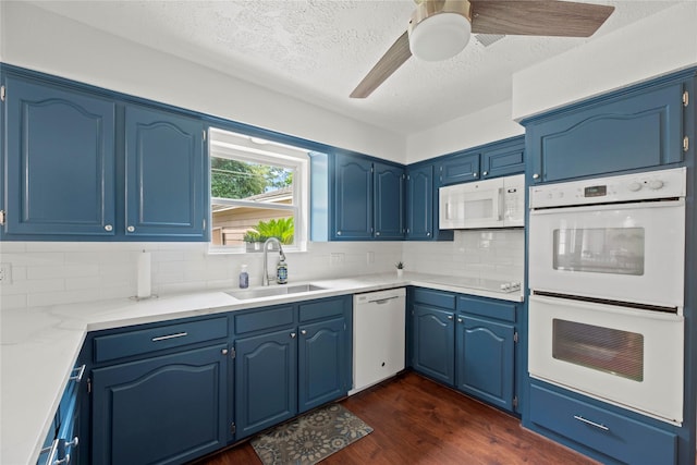 8223 Bairnsdale Ln, Houston, TX 77070 - kitchen with white appliances, a sink, dark wood-style floors, a ceiling fan, and backsplash