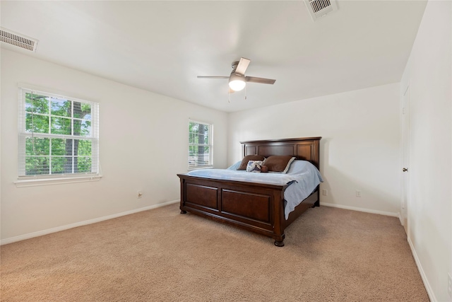 8223 Bairnsdale Ln, Houston, TX 77070 - bedroom featuring light carpet, baseboards, and ceiling fan