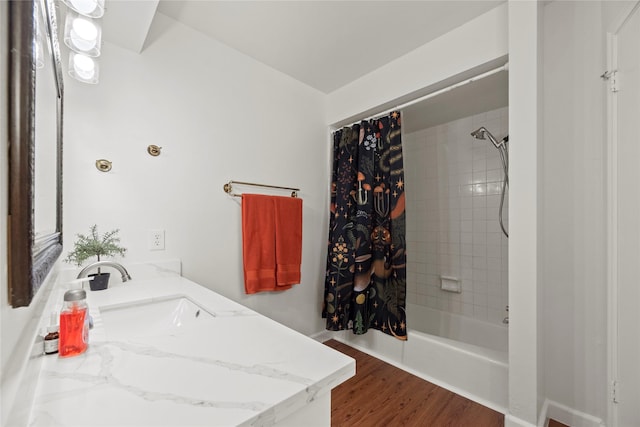 8223 Bairnsdale Ln, Houston, TX 77070 - full bath featuring shower / bathtub combination with curtain, vanity, and wood finished floors