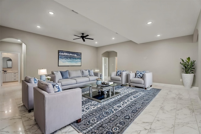 69 County Road 3668, Splendora, TX 77372 - living area featuring arched walkways, light marble finish flooring, ceiling fan, and recessed lighting