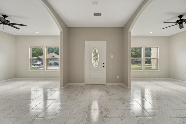 69 County Road 3668, Splendora, TX 77372 - entryway with ceiling fan, arched walkways, healthy amount of natural light, and recessed lighting