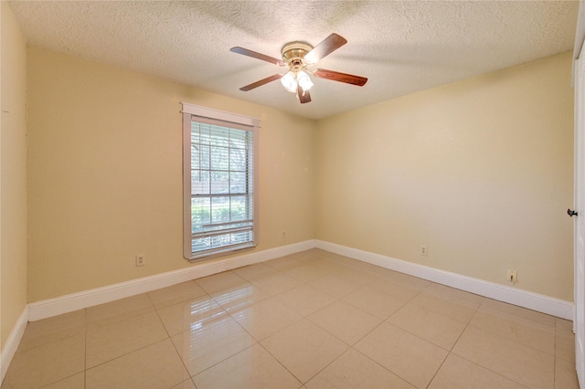 2815 Lakefield Way, Sugar Land, TX 77479 - unfurnished room featuring a textured ceiling, a ceiling fan, light tile patterned flooring, and baseboards