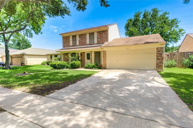 2815 Lakefield Way, Sugar Land, TX 77479 - traditional-style home featuring brick siding, a garage, and concrete driveway