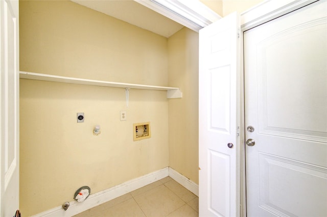 2815 Lakefield Way, Sugar Land, TX 77479 - laundry area with gas dryer hookup, electric dryer hookup, light tile patterned flooring, washer hookup, and baseboards