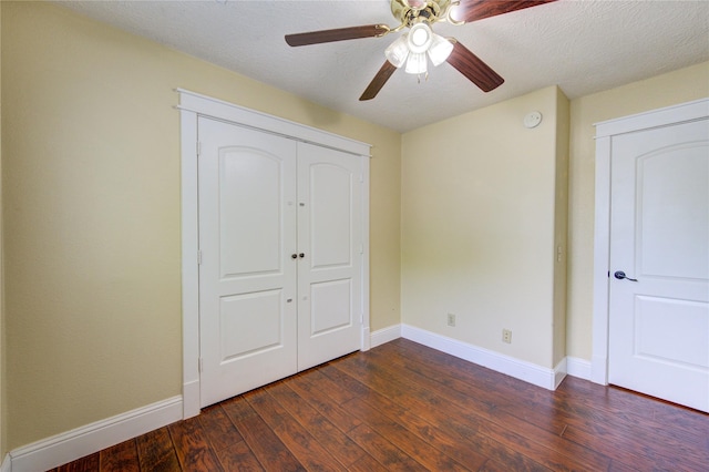 2815 Lakefield Way, Sugar Land, TX 77479 - unfurnished bedroom featuring dark wood-type flooring, baseboards, a closet, ceiling fan, and a textured ceiling