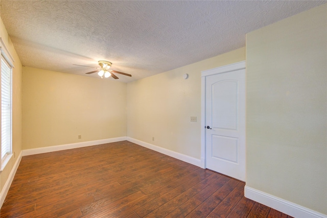 2815 Lakefield Way, Sugar Land, TX 77479 - spare room with a ceiling fan, dark wood-style flooring, healthy amount of natural light, baseboards, and a textured ceiling