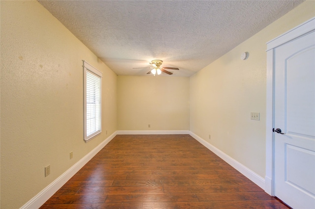 2815 Lakefield Way, Sugar Land, TX 77479 - empty room featuring dark wood-type flooring, ceiling fan, a textured ceiling, baseboards, and a smoke detector
