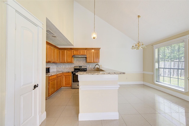 2815 Lakefield Way, Sugar Land, TX 77479 - kitchen featuring appliances with stainless steel finishes, light tile patterned flooring, backsplash, baseboards, and high vaulted ceiling