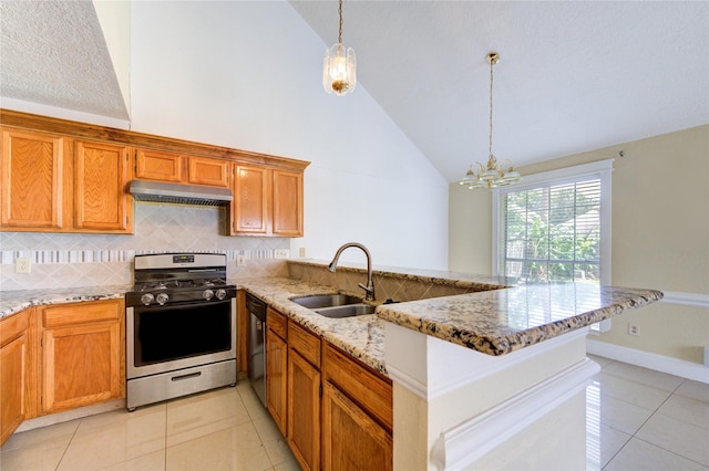 2815 Lakefield Way, Sugar Land, TX 77479 - kitchen with stainless steel gas stove, a sink, a peninsula, under cabinet range hood, and light tile patterned floors