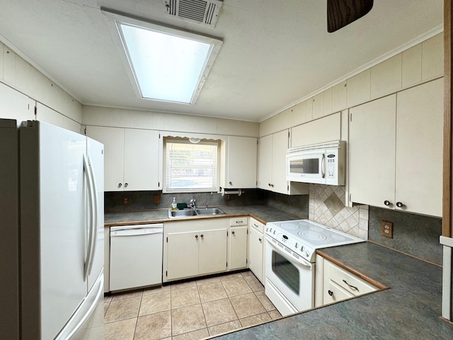 121 Briar Ln, Crockett, TX 75835 - kitchen featuring white appliances, a sink, dark countertops, tasteful backsplash, and light tile patterned floors