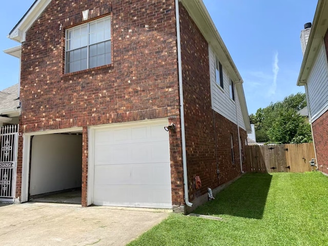 11830 Meadow Place Dr, Houston, TX 77071 - view of home's exterior featuring brick siding, an attached garage, driveway, and a gate