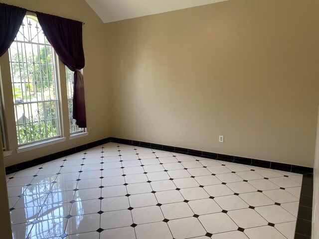 11830 Meadow Place Dr, Houston, TX 77071 - spare room with light floors, baseboards, and vaulted ceiling