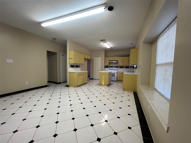 11830 Meadow Place Dr, Houston, TX 77071 - kitchen featuring gas range, light floors, a sink, light countertops, and baseboards