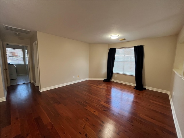 11830 Meadow Place Dr, Houston, TX 77071 - spare room featuring dark wood-type flooring, healthy amount of natural light, and baseboards