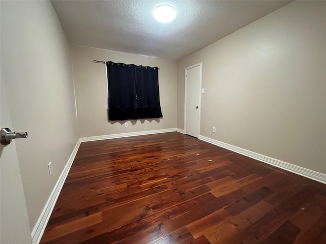 11830 Meadow Place Dr, Houston, TX 77071 - spare room featuring dark wood-type flooring and baseboards